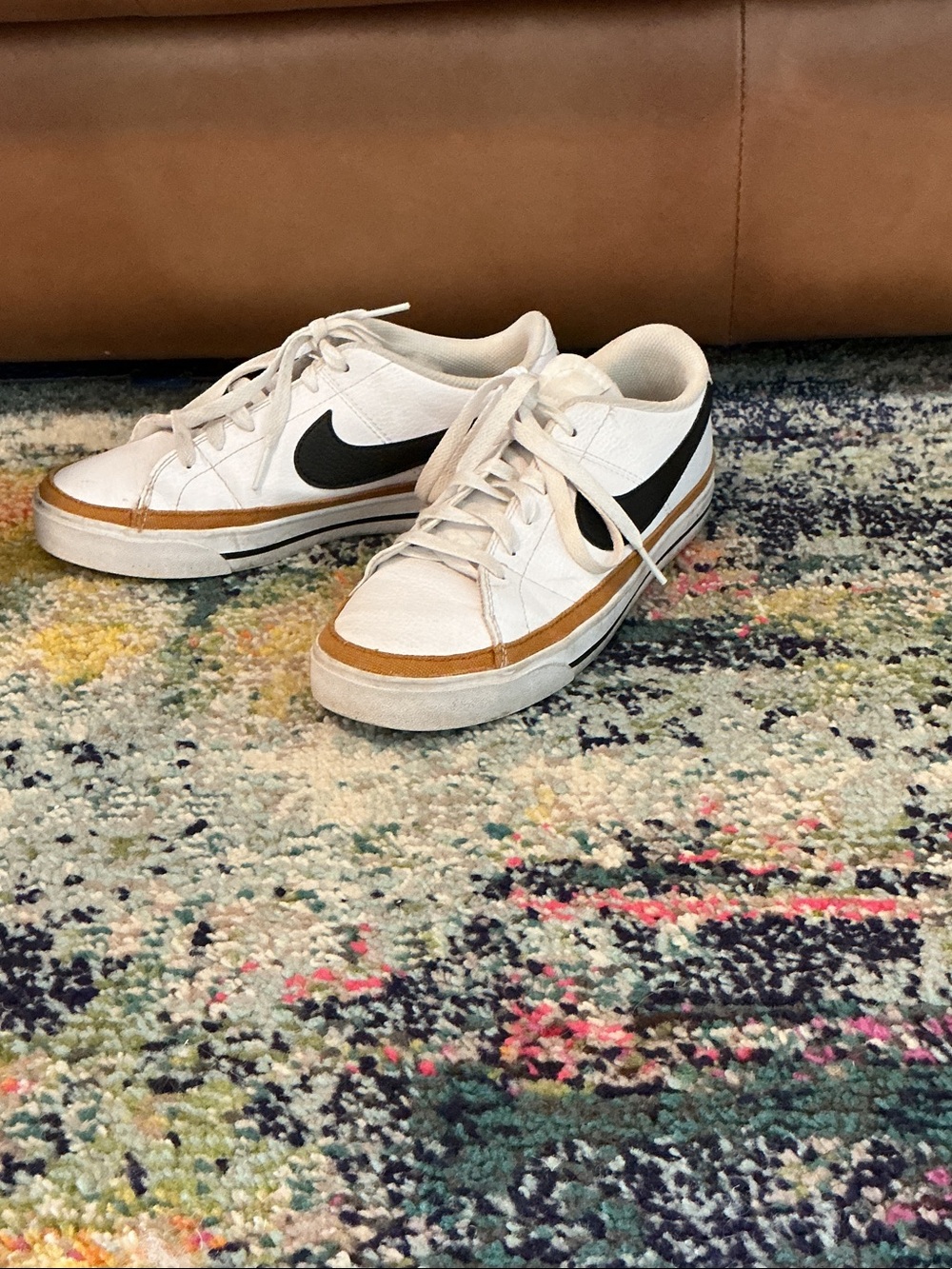 Nike Kids White Sneakers with Black Swoosh and Brown Trim